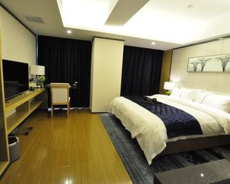 Mingchun International Hotel - Kunming - Bedroom
