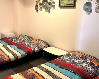 Guest house Blue Ocean Naha - Hostel - Naha - Phòng ngủ