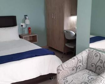 Masane Lodge - Rustenburg - Schlafzimmer