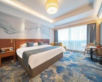 Zhucheng Huaxu Hotel (Dinosaur Park) - Rizhao - Bedroom
