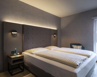 Achat Hotel LÜneburger Heide - Hodenhagen - Schlafzimmer