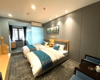 Shell Hotel Luzhou Longmatan District Dujia Street Riverside - Luzhou - Bedroom