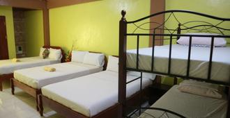 Centillo Travellers Inn - Malay - Bedroom