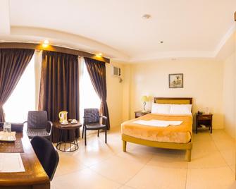 Rizmy Apartment Hotel - Cabuyao - Slaapkamer