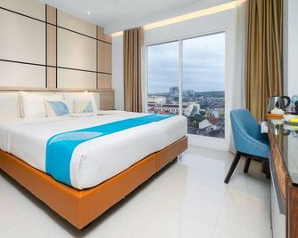 Java Lotus Hotel Jember - Jember - Slaapkamer