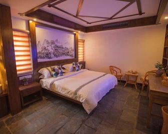 The Longmen One Inn - ג'אנגג'יאיי - חדר שינה