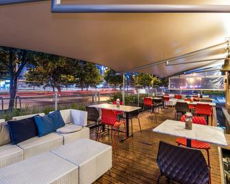 Cosmos 100 Hotel & Centro de Convenciones - Hoteles Cosmos - בוגוטה - מסעדה