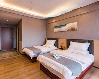 Pu'er Wanlin Theme Hotel - Pu'er - Habitación