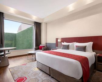 Ramada by Wyndham Lucknow Hotel and Convention Center - Lucknow - Κρεβατοκάμαρα