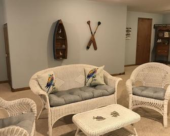 Lake House on a 4 Acre Wooded Lot With Hot Tub, wooded trails & kayaks! - Otsego - Living room