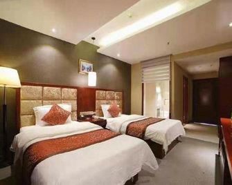 Changbai Mountain Woersi Hotel (Changbai Mountain West Scenic Area Ticket Office) - بايشان - غرفة نوم