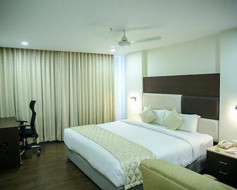 Hotel Blossoms - Tiruchirappalli - Slaapkamer
