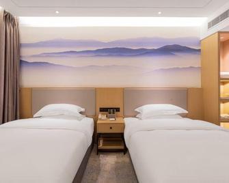 Tian Bo Hotel - Leshan - Schlafzimmer