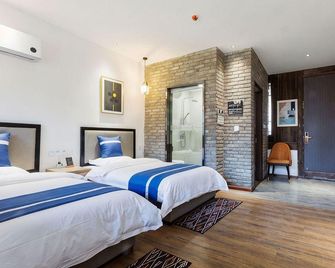 Zhuxianzhen Pillow Water Homestay - Kaifeng - Schlafzimmer