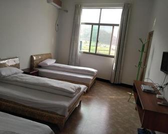 Wuyuan Jiangling huatian Hostel - הואנגשאן - חדר שינה