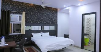 Hotel Saraogi Palace - Gaya - Bedroom