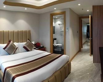 One Euphoria Luxe Hotel - Angeles City - Slaapkamer