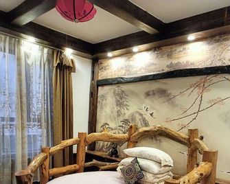 Jieshangxian Yunjian Inn - Zhangjiajie - Bedroom