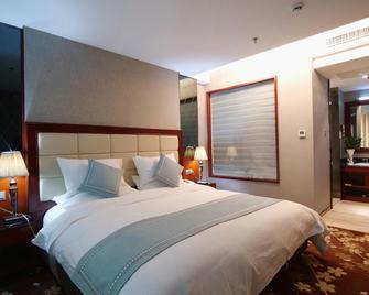Dandong Jiangbin International Hotel (Yalu River Broken Bridge Scenic Spot Railway Station Branch) - Dandong - Bedroom