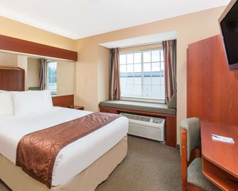 Microtel Inn & Suites by Wyndham Rogers - Rogers - Bedroom