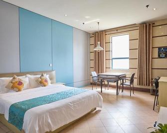 Guoli Hotel - Nanjing - Schlafzimmer