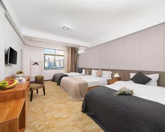 Haikou 9+1 Hotel (Meilan Airport) - Haikou - Bedroom