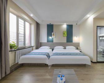 Jin Yue Business Hotel (Baotou Alding Street Museum Branch) - Baotou - Bedroom