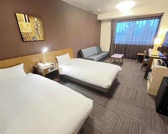 Route Inn Grantia Hidatakayama Wakura no yado - טקאיאמה - חדר שינה