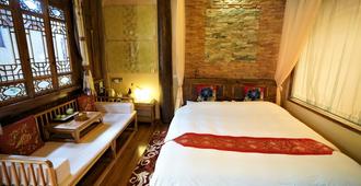 Lijiang Lvyeanjia Inn - Lijiang - Bedroom