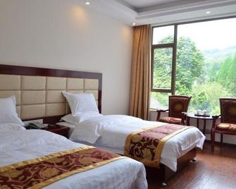 Emeishan Donghui Grand Hotel - Le-šan - Ložnice