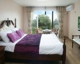 Stone and Wind Resort - Seogwipo - Yatak Odası