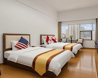 Kunming Ha Te Da Zhen Plaza Hotel - Kunming - Habitación