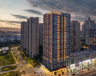Orange Hotel Lianyungang Wanda Huaguoshan Avenue - Lianyungang - Byggnad