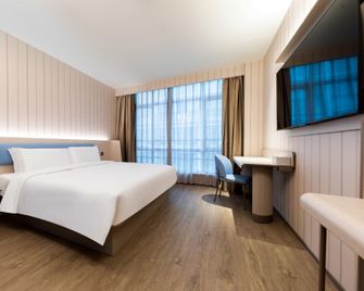 Hanting Hotel Wuxi Xinqu Changjiang Road - Wuxi - Camera da letto