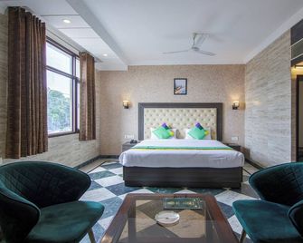 Treebo Trinetar International - Jammu - Bedroom