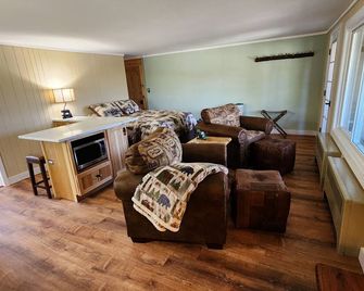 Awesome mountain view with private patio, Fantastic location right on Main St. - Lake Placid - Living room
