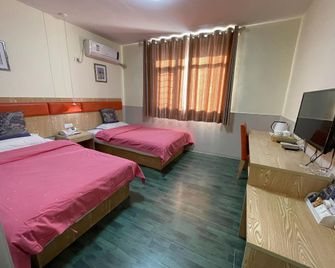 Xingyue Hotel (Xinxiang County Xiaoji Branch) - Xinxiang - Спальня