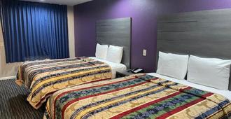 Executive Inn & Suites Houston - Houston - Schlafzimmer