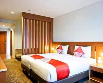 Capital O 847 Megara Hotel - Pekanbaru - Habitación