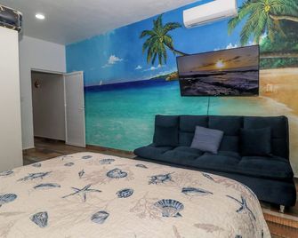 One bedroom. Outdoor Pool, outdoor grill, mezzanine floor. Kids welcome - Cozumel - Schlafzimmer