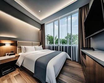 Hengyuan Holiday Hotel - Huizhou - Schlafzimmer
