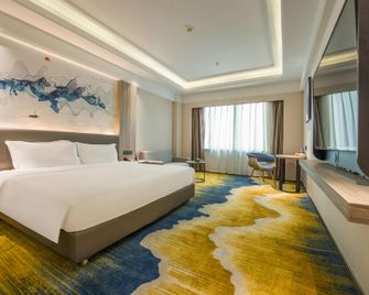 Huahai Hotel Maoming high speed railway station - Maoming - Bedroom