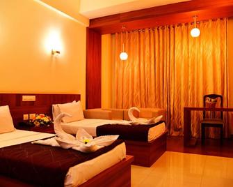 Sasthapuri Hotels - Gudalur - Camera da letto