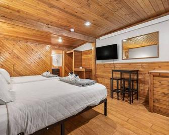 Room 17 – Queen Beds - Lead - Slaapkamer