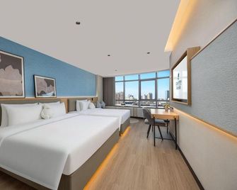 Liyi Hotel (Urumqi Hetian Second Street Dehui Wanda Branch) - Ürümqi - Bedroom