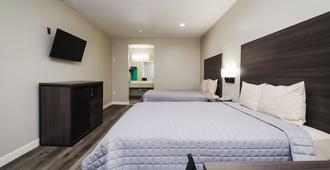 Winchester Inn & Suites Humble / IAH / Houston Northeast - Humble - Yatak Odası