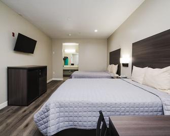 Winchester Inn & Suites Humble / IAH / Houston Northeast - Humble - Bedroom