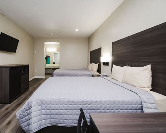 Winchester Inn & Suites Humble / IAH / Houston Northeast - Humble - Bedroom