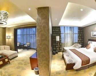 Huanuo Xinjinglun International Hotel - Changzhi - Schlafzimmer