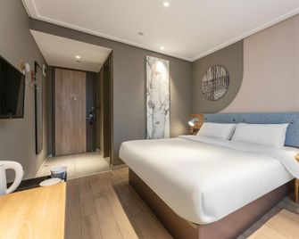 Home Inn Neo Chizhou Qiupu West Road Xiushanmen Plaza - Chizhou - Slaapkamer